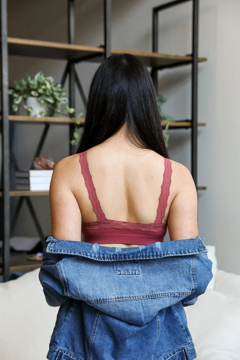 Woman in denim jacket and jeans showcasing Lace Trim Padded Bralette for feminine elegance