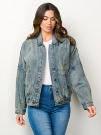 Woman in a stylish long sleeve button closure pockets denim jacket