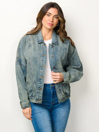 Woman wearing a Long Sleeve Button Closure Pockets Denim Jacket in a stylish setting