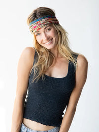 Smiling woman in dark tank top showcasing FULL BOHO BANDEAU HEADBAND from Shop Daisy