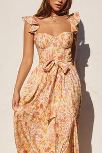 Woman in a floral print SUMMER DRESS, featuring a corset top design, SUNNY DAYS MAXI DRESS