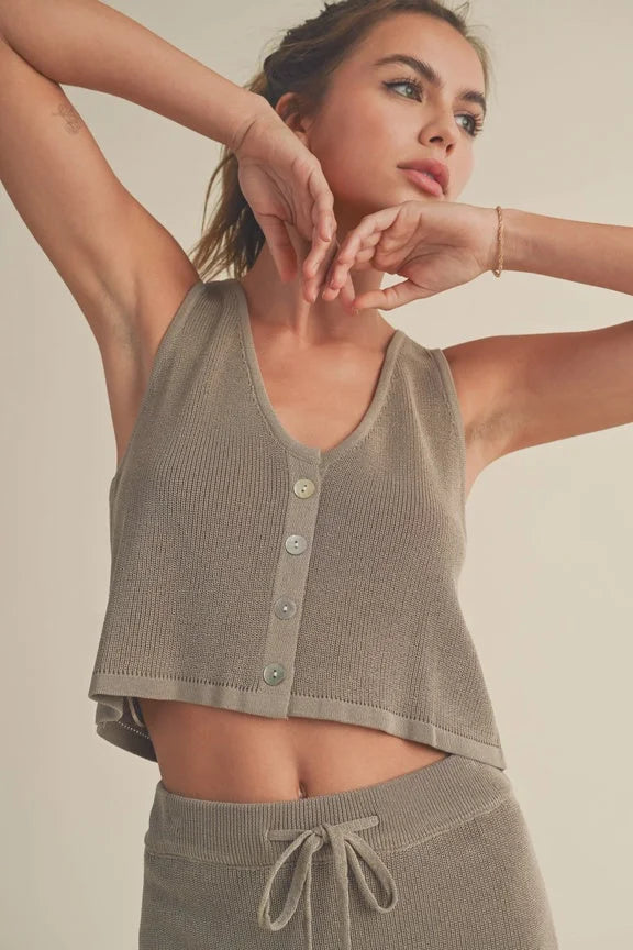 Woman in gray knit tank top and bottoms, showcasing women’s boho chic clothing from Shop Daisy