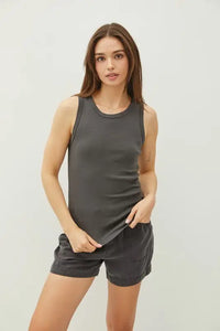 Woman in gray tank top and shorts modeling BASIC SOLID RAISED HEM COTTON CREW NECK TANK