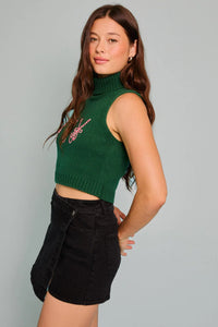 Woman modeling the Turtle Neck Sleeveless Cropped Joy Top with black shorts