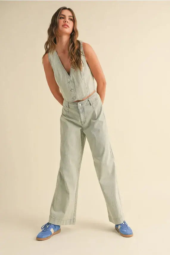 Woman in a green vest and pants showcasing Faded Stripe Pattern Pants