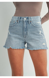 Woman in grey top and blue denim shorts showcasing High Rise A Line Beach Denim Shorts