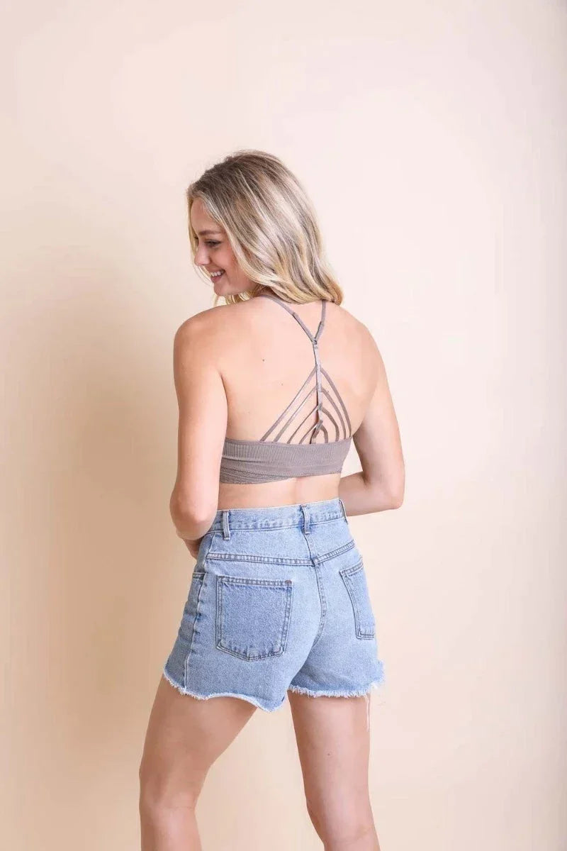 Woman in grey top and denim shorts showcasing a High Neck Crochet Lace Trim Bralette