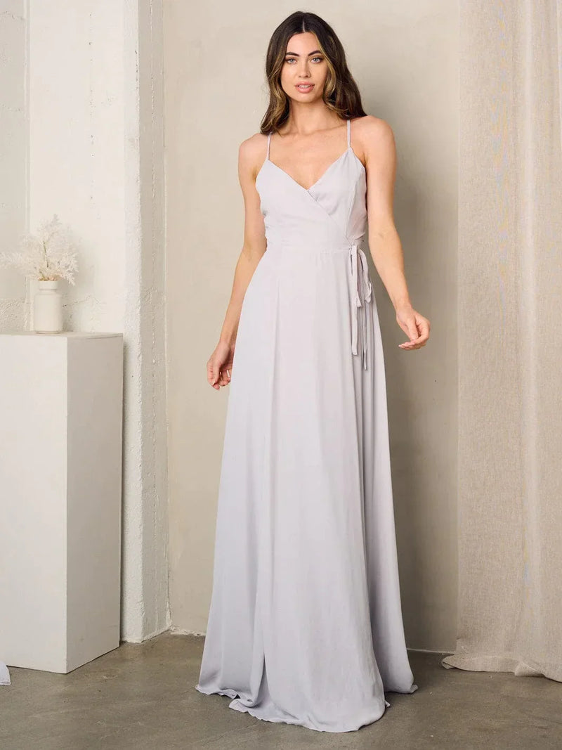 Woman in a grey Sleeveless Surplice Self Tie Maxi Dress showcasing elegant style