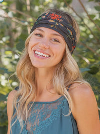 Woman wearing a Charcoal Floral Boho Bandeau, showcasing a stylish headwrap head tie