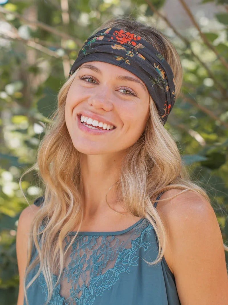 Woman wearing a Charcoal Floral Boho Bandeau, showcasing a stylish headwrap head tie