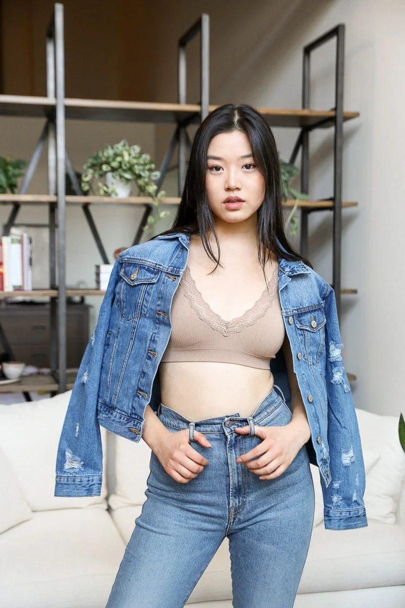 Woman in jeans and top showcasing feminine elegance with Lace Trim Padded Bralette