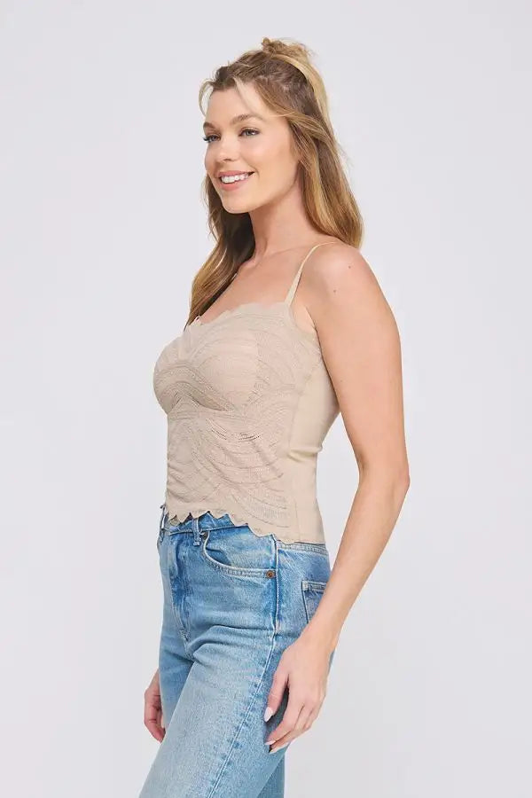 Woman wearing a lace bralette cami and jeans, perfect for women’s boho chic clothing