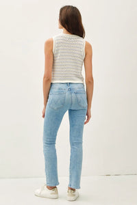 Woman in light blue jeans and white crocheted top modeling Chunky Knit Striped Sweater Tank