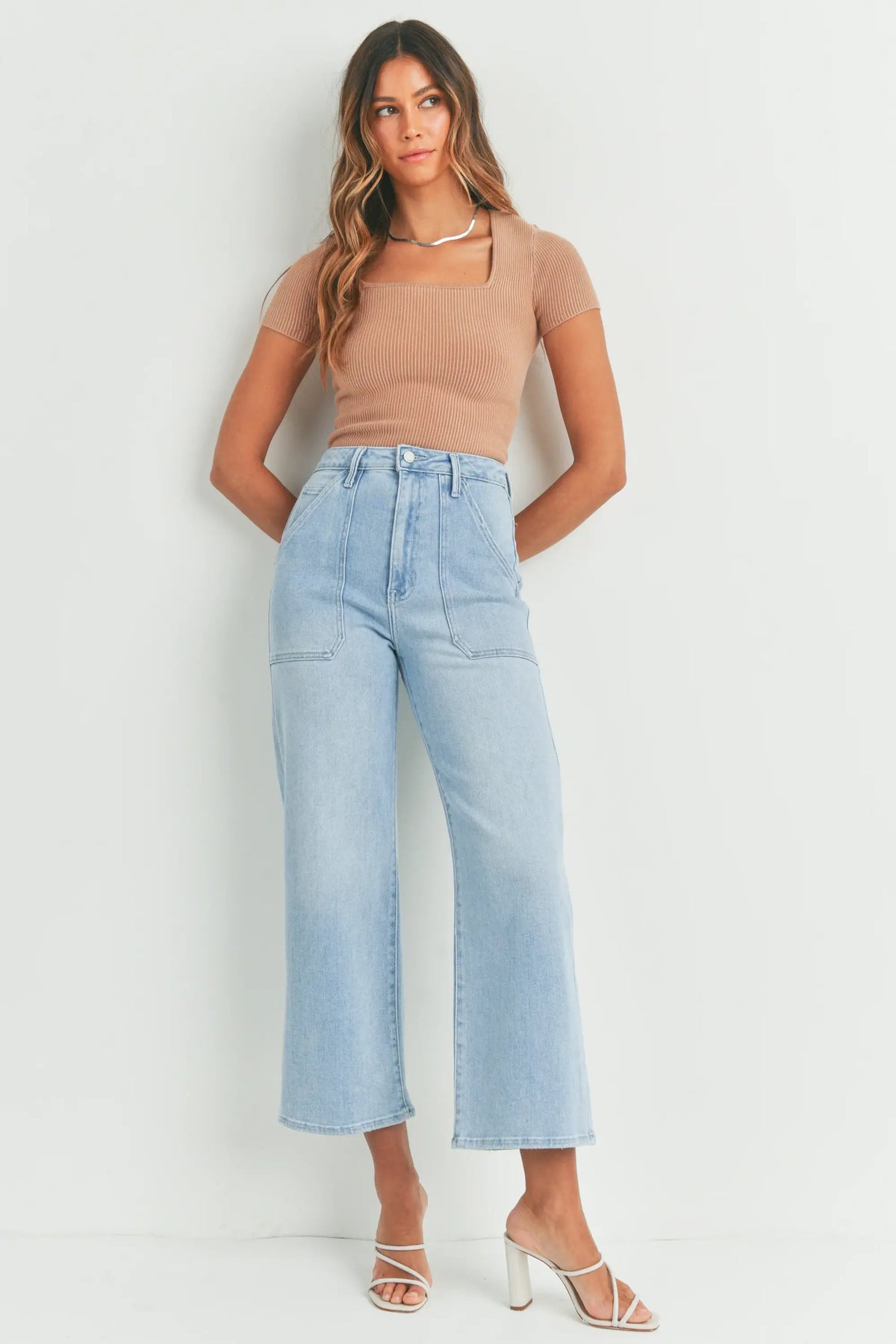 Woman in light blue wide-leg jeans from THE CARGO PATCH POCKET collection at Shop Daisy