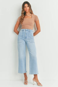 Woman in light blue wide-leg jeans from THE CARGO PATCH POCKET collection at Shop Daisy