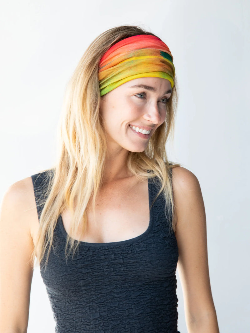 Boho Bandeau Headband - Rainbow Ombre worn by a woman with long blonde hair