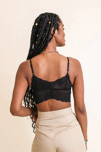 Woman with long braid wearing Butterfly Scallop Lace bralette with padding