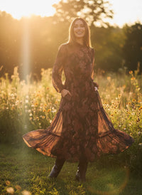 Woman wearing LOST + WANDER Whispers of Bohemia Maxi Dress in a floral bohemia maxi style