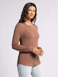 Woman wearing Long Sleeve Basic Stacy Top in light brown with light wash jeans from the basics collection