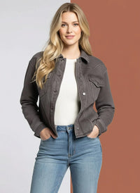 Woman modeling the Supply Marion Jacket with a white ribbed top and light-wash jeans
