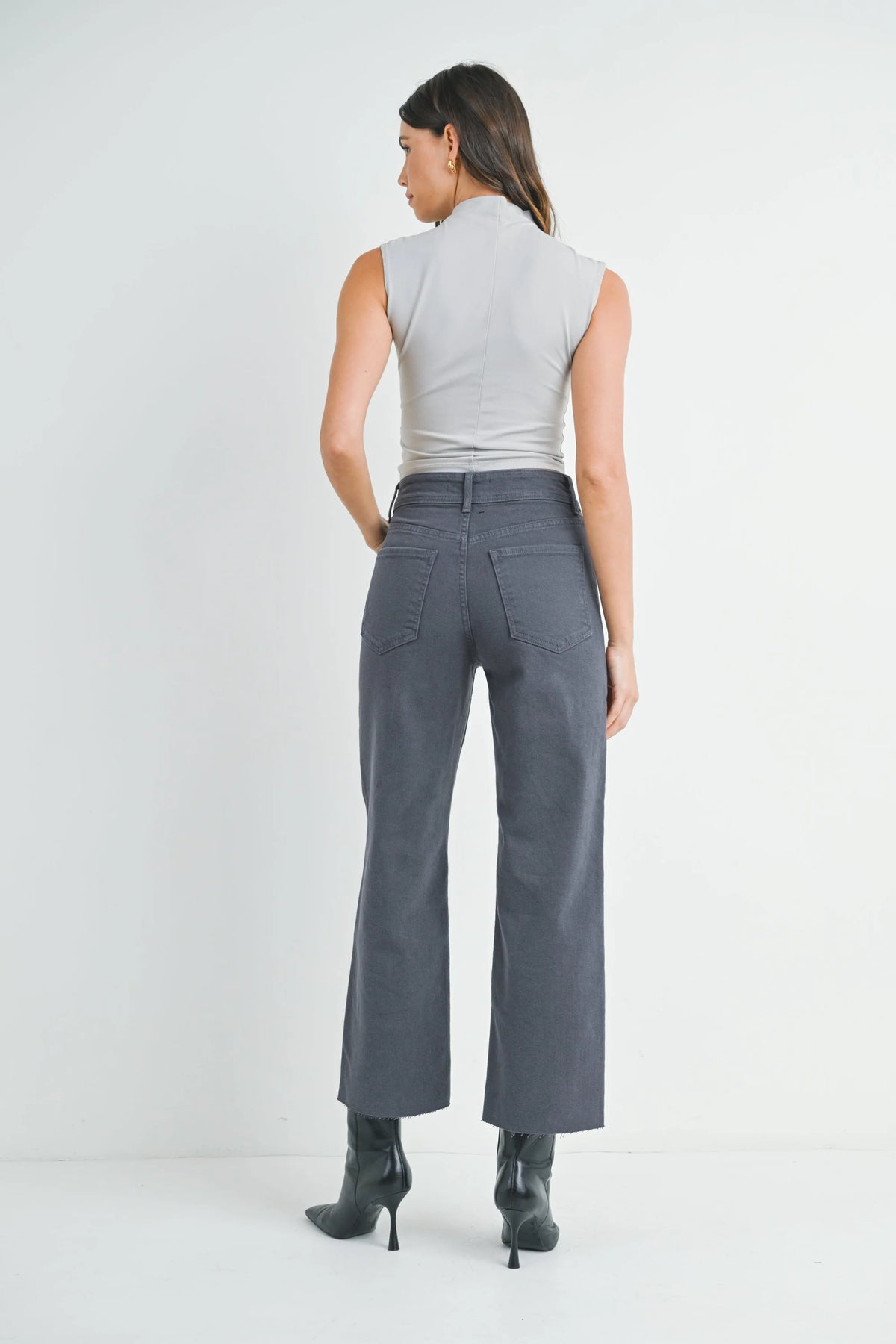 Woman modeling NAUTICAL HIGH RISE WIDE LEG DENIM with light gray sleeveless top