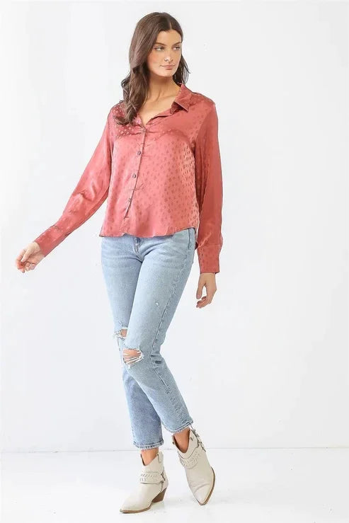 Woman in a pink blouse showcasing the Flowy Satin Diamond Print Button-Up Long Sleeve T-Shirt Top