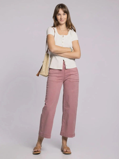 Woman wearing THREAD & SUPPLY LORETTA PANTS high-rise pink ankle cotton pants
