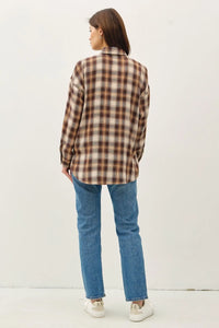 Woman in ultra soft oversized flannel shirt and jeans styled casually