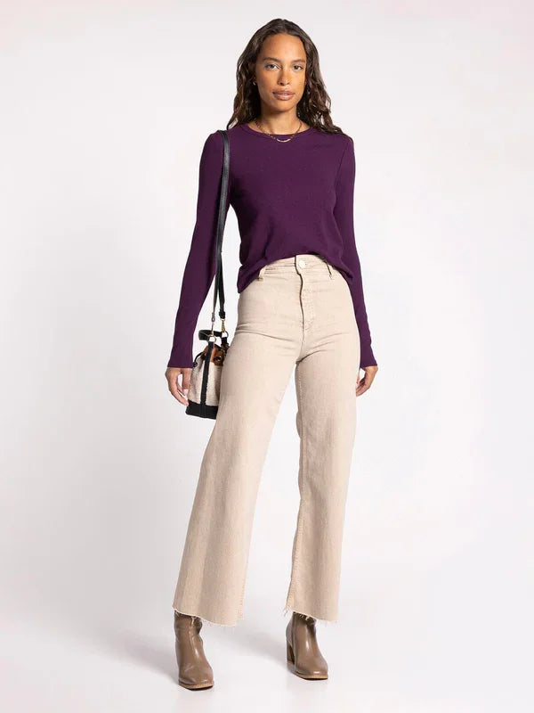 Woman in a purple sweater and beige wide-leg pants featuring a Micro Ribbed Ultra Soft Long Sleeve Top