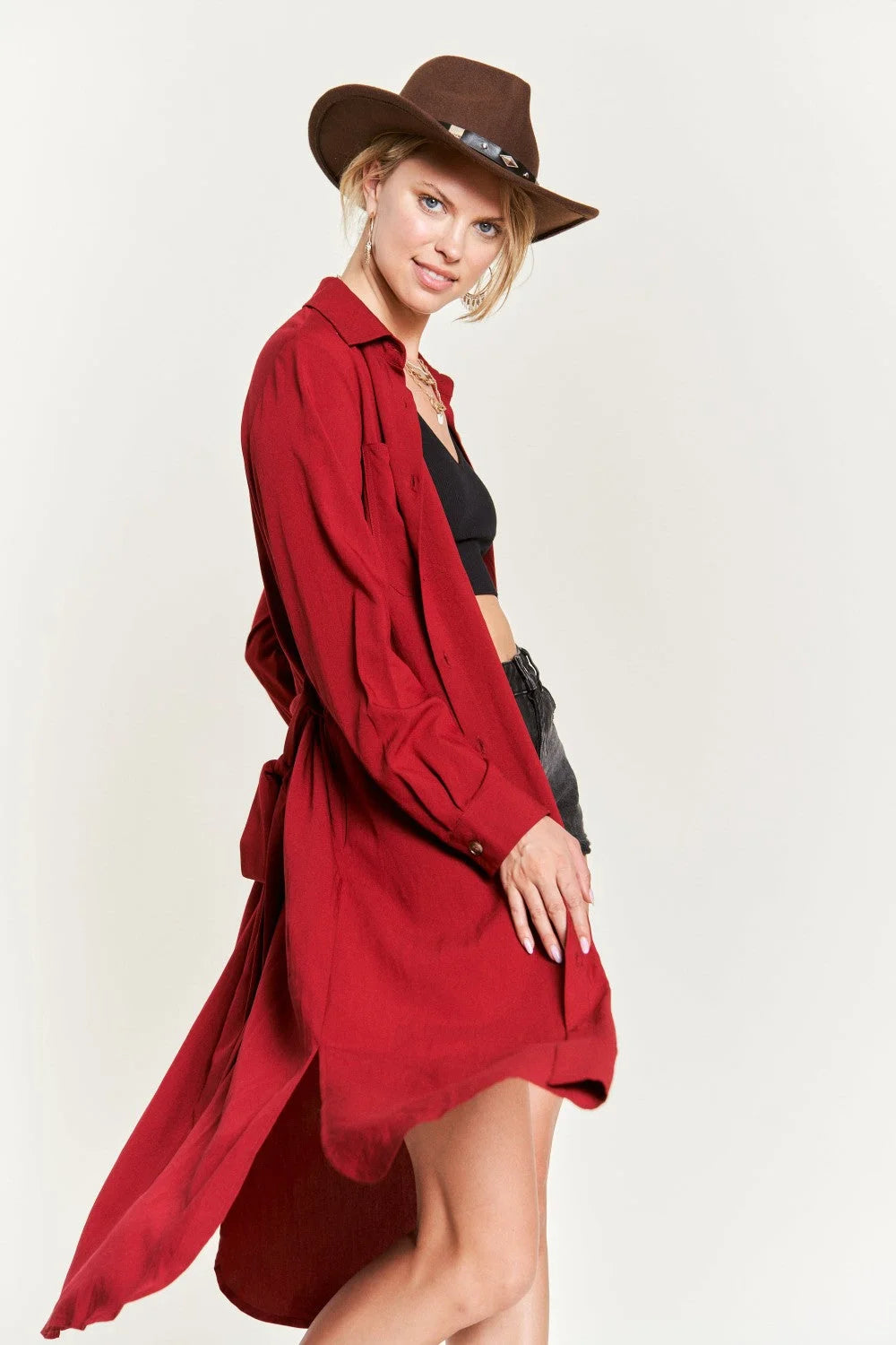 Woman in red coat and hat showcasing SOLID BUTTON DOWN BELTED LONG DRESS