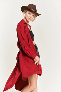 Woman in red coat and hat showcasing SOLID BUTTON DOWN BELTED LONG DRESS