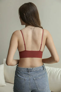 Woman in a red top and jeans wearing the Waistband Loop Lace Seamless Brami Bralette