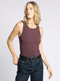 Woman wearing Edlin Basic Tank in maroon with dark wash jeans and black belt