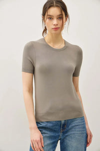 Ultra soft women’s boho chic short sleeve knit top paired with blue jeans