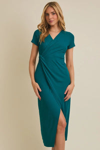 Woman in teal short sleeve surplice twist midi dress with high slit and V-neckline