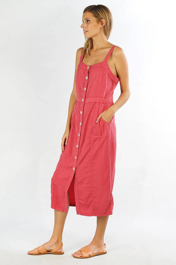 Woman wearing a TENCEL BUTTON UP sleeveless midi dress in reddish-pink with belt and sandals