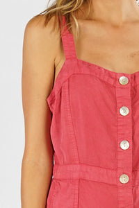 Woman wearing a sleeveless midi dress in red TENCEL BUTTON UP fabric