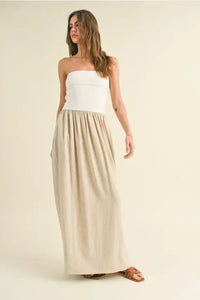 Woman in strapless top and long skirt showcasing Linen Knitted Top Combo Dress with care instructions