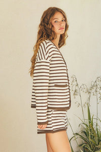 Woman in striped long-sleeved top and shorts from Shop Daisy’s women’s boho chic clothing