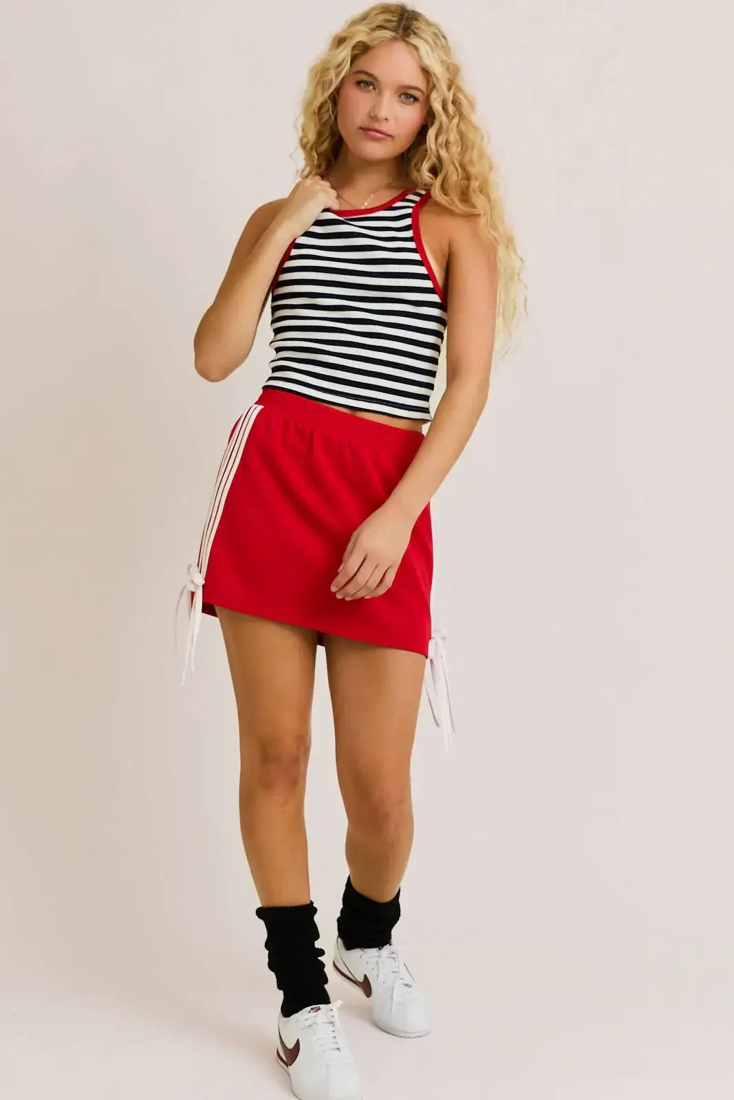 Woman wearing a nautica summer stripe tank top in a striped design