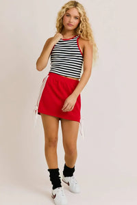 Woman wearing a nautica summer stripe tank top in a striped design