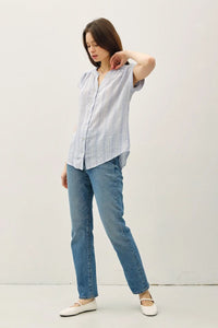 Woman in striped shirt with mandarin collar showcasing women’s boho chic clothing