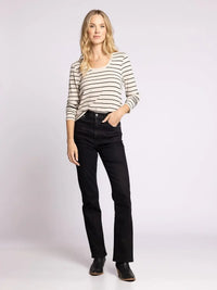 Woman in striped shirt and black jeans showcasing THREAD AND SUPPLY LAUREN TOP, perfect for women’s boho chic clothing