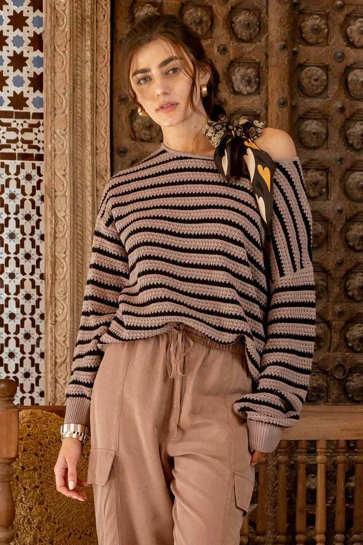 Woman in a Relaxed Stripe Knit Pullover Sweater with beige cargo pants