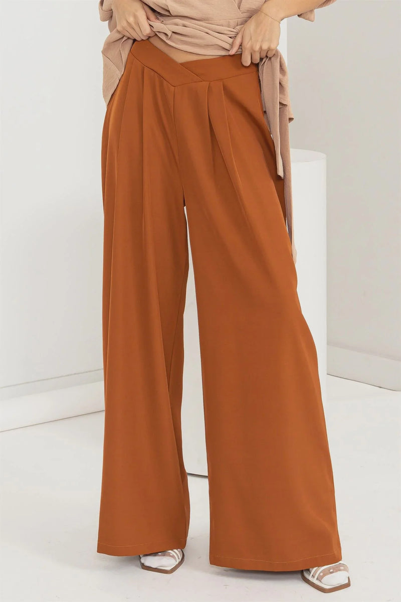 Woman in tan top models High-Waist Wide-Leg Pants, showcasing stylish comfort