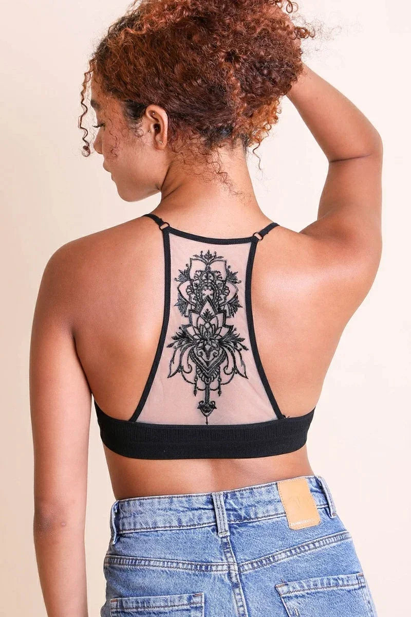 Woman showcasing a tattoo on her back while wearing a Tattoo Mesh Racerback Bralette