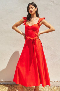 Woman modeling HEAVEN SENT CORSET FLUTTER DRESS with ruffled shoulder straps and tie waist