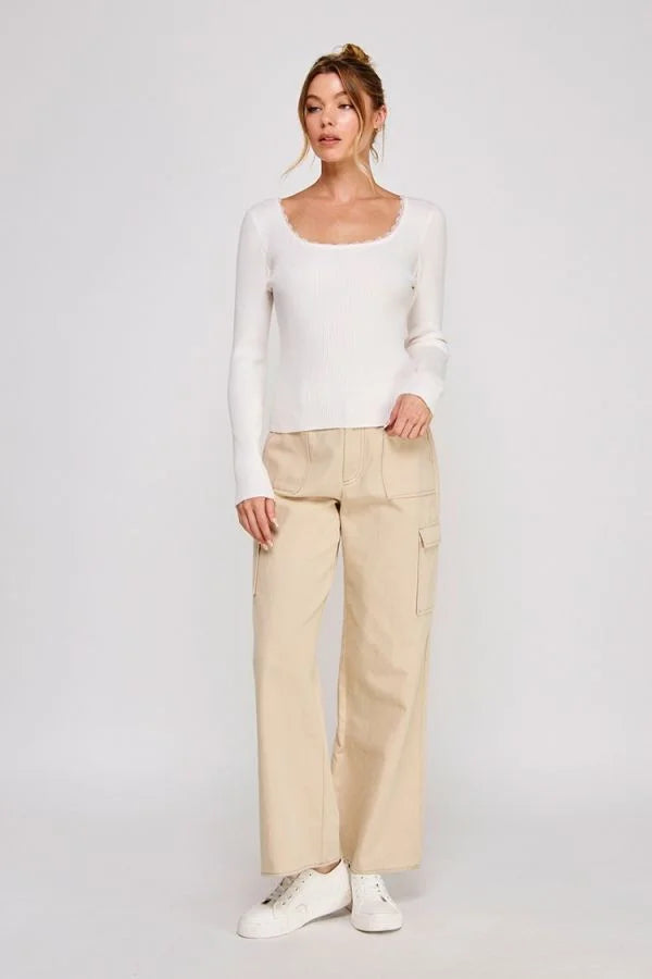 Woman in Gauge Rib Square Neck Lace Trim Top with white knit texture