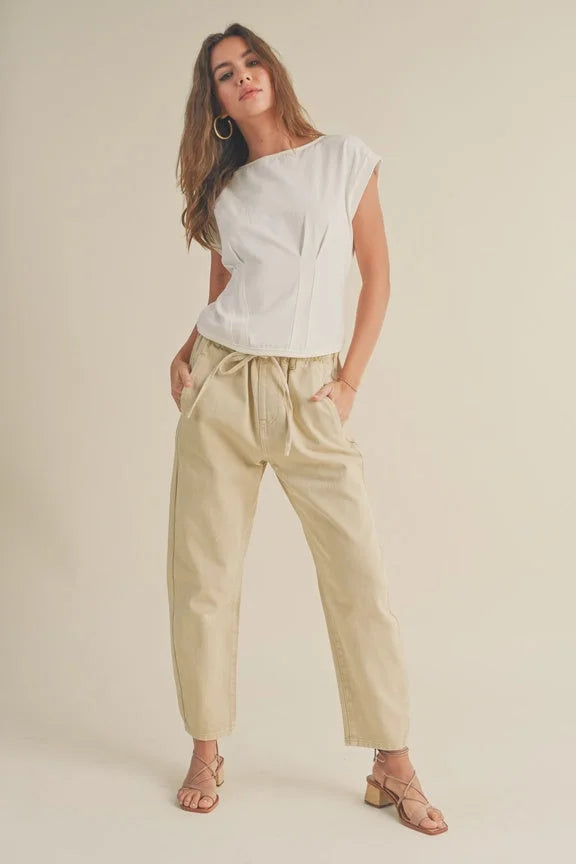 Woman in a white top and beige pants showcasing the Corset Style Body Top