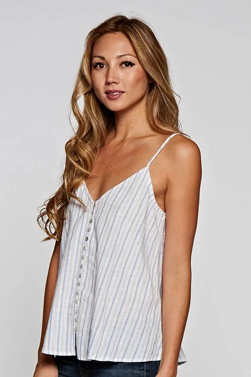 Woman wearing white and blue striped button-up camisole from Shop Daisy womens boho clothes